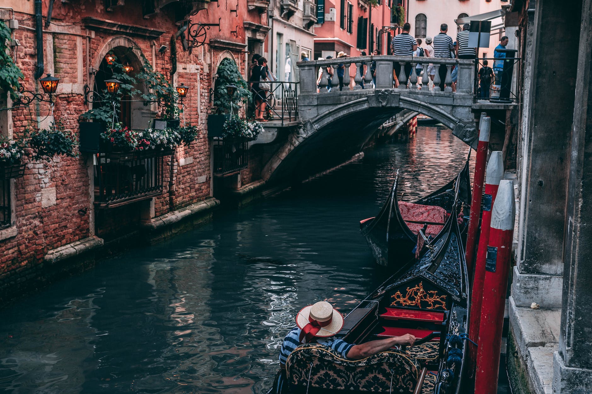 photo of man riding canoe