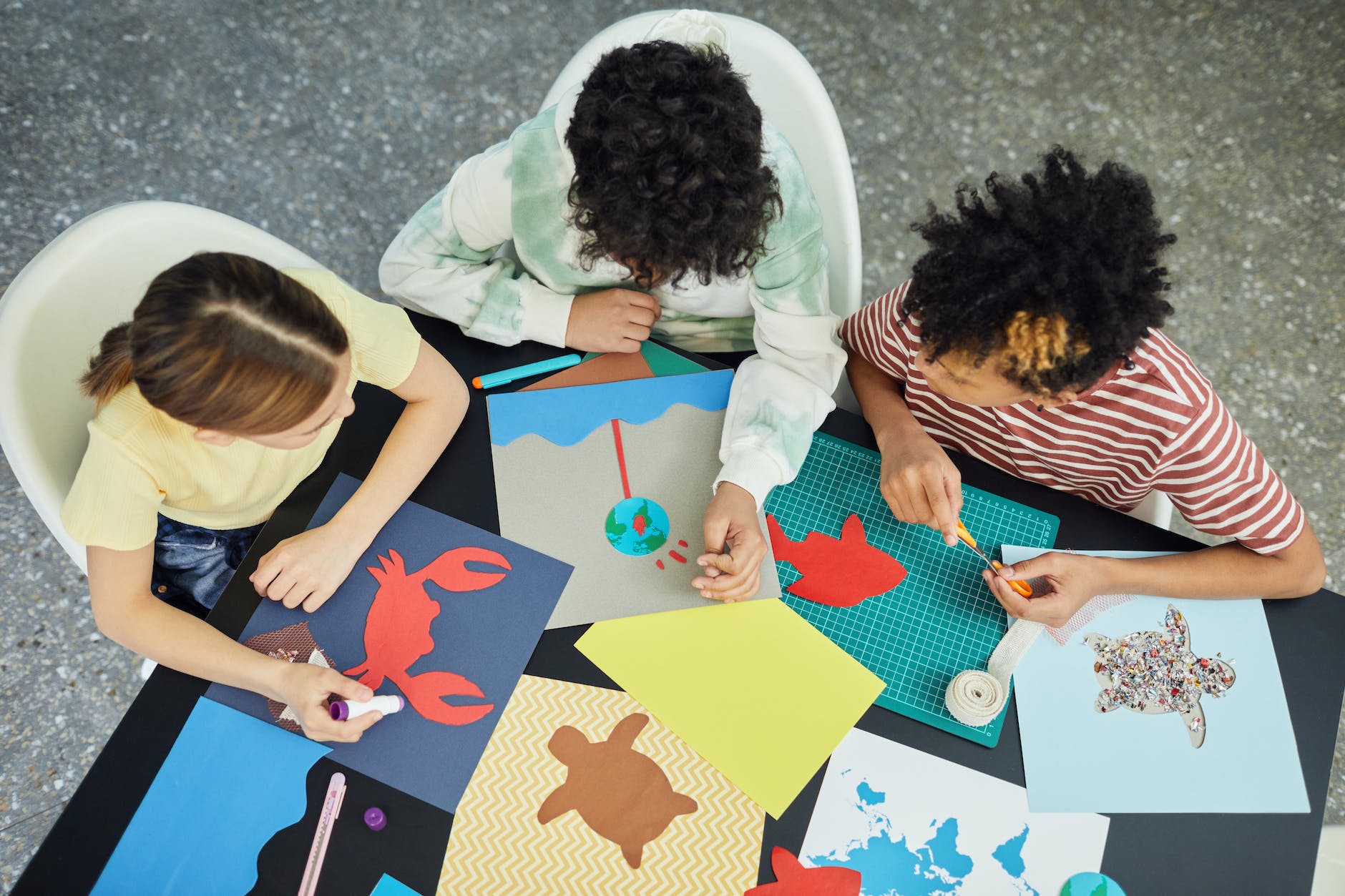 group of diverse kids making drawings